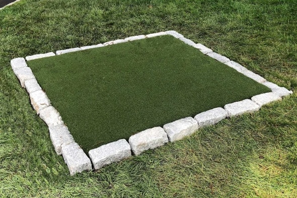 Los Angeles and Southern California Tee box made of synthetic grass surrounded by stone border
